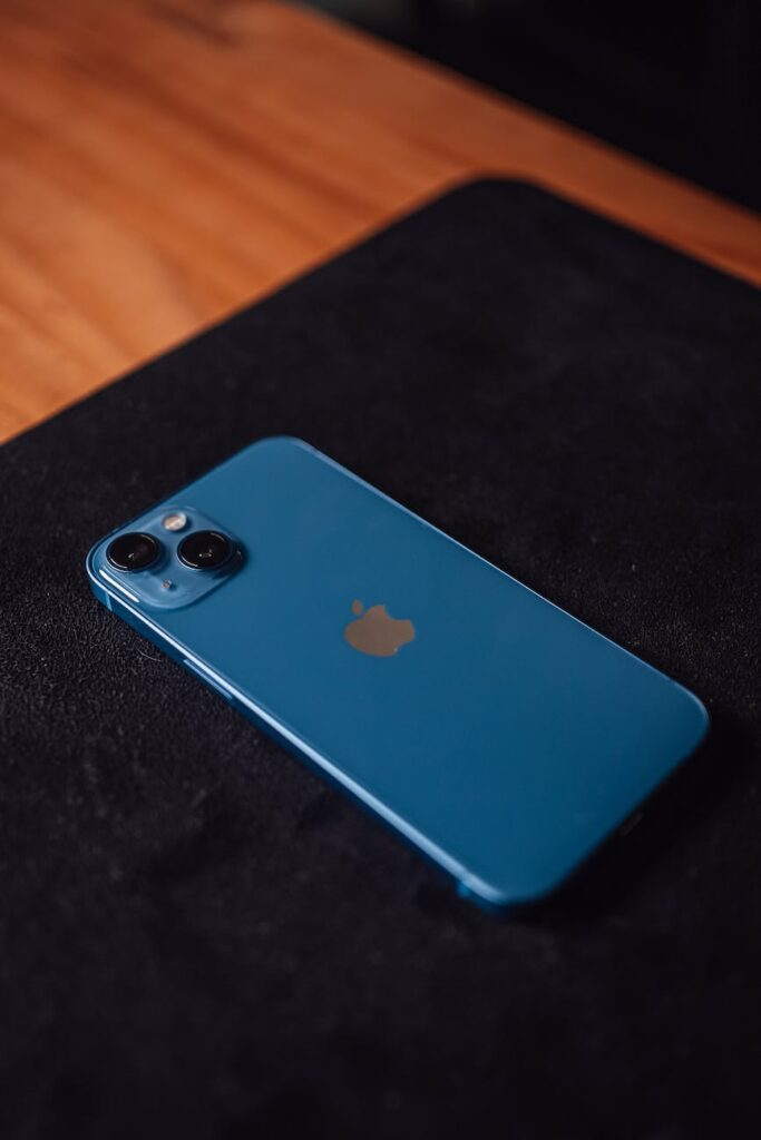 a blue iphone on the table